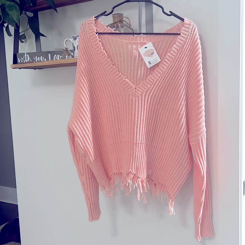 Women’s size L, pink sweater.